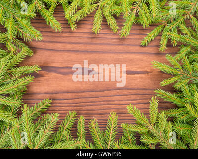Christmas frame with the branches of the Christmas tree and wooden ...