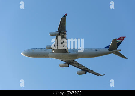 South African Airways Airbus A340-313 aircraft taking off from Heathrow Airport, Greater London, England, United Kingdom Stock Photo