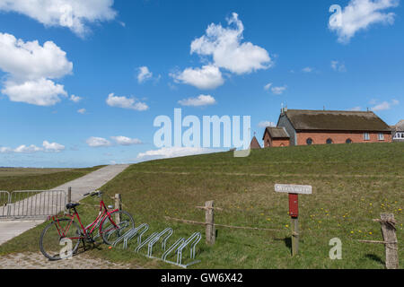 Small church on an earth mound on the islet of Langeness in the mud flats, North Sea, Schleswig-Holstein, Germany Stock Photo