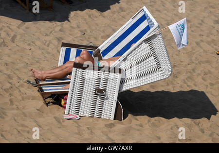 Berlin, Germany. 12th Sep, 2016. People at the Wannsee public bathing beach sunbathing in temperatures of around 30 degrees Celcius, in Berlin, Germany, 12 September 2016. PHOTO: RALF HIRSCHBERGER/DPA/Alamy Live News Stock Photo