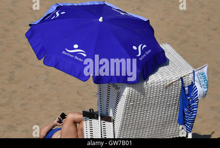 Berlin, Germany. 12th Sep, 2016. A sunbather at the Wannsee public bathing beach in temperatures of around 30 degrees Celcius, in Berlin, Germany, 12 September 2016. PHOTO: RALF HIRSCHBERGER/DPA/Alamy Live News Stock Photo
