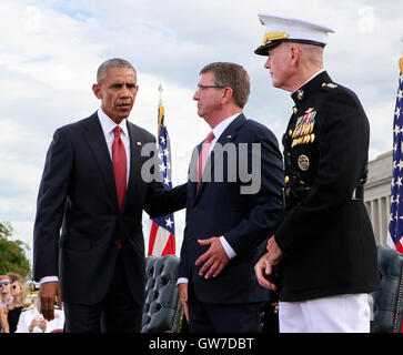 WASHINGTON DC - SEPTEMBER 11: United States President Barack Obama, left, with US Secretary of Defense Ash Carter, center, and US Marine Corps General Joseph F. Dunford Jr., Chairman of the Joint Chiefs of Staff, right, at the Pentagon Memorial in Washington, DC during an observance ceremony to commemorate the 15th anniversary of the 9/11 terrorist attacks, Sunday, September 11, 2016. Credit: Dennis Brack / Pool via CNP/MediaPunch Stock Photo