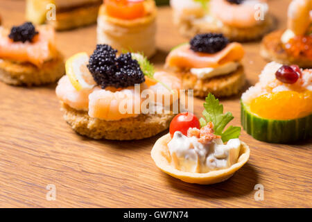 Exquisite selection of luxury canapes, appetizer ready to be served for events, celebrations or other occasion Stock Photo