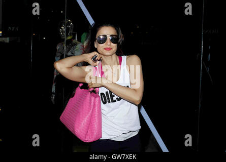 Ameesha Patel flashes her personalized Louis Vuitton bag at PVR Cinemas, in  Mumbai, on April 28, 2013.