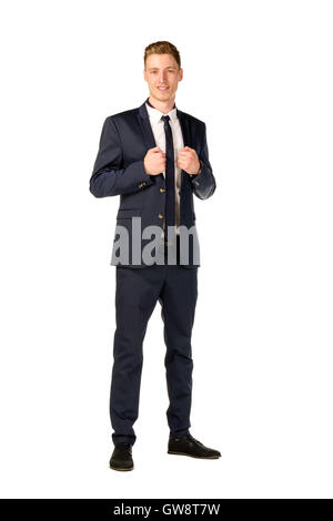 Full length portrait of a young man presenting in front of tv screen on ...