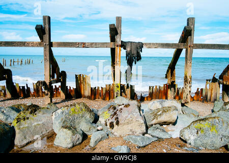 Battered sea defences on Norfolk coast Stock Photo