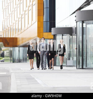 Group of business people walking in down town near office building Stock Photo