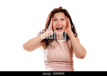 portrait of happy mature woman looking puzzled and surprised with open mouth as she is shouting while hands are holding head, isolated on white background. Stock Photo