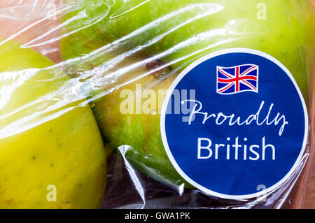 Proudly British label with Union Jack flag on a bag of Bramley cooking apples from Waitrose. Stock Photo