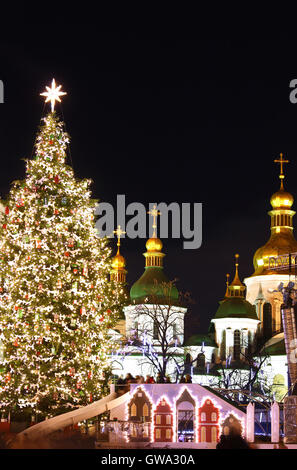 St. Sophia Cathedral, Christmas market, and main Kyiv's New Year tree on Sophia Square in Kyiv, Ukraine Stock Photo