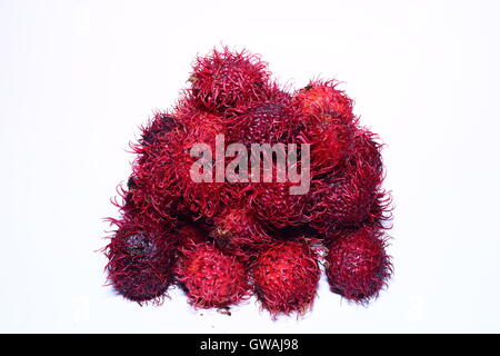 Pile of rambutan against a white background Stock Photo