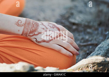 Hand yoga with brown henna mehendi. Harmony Stock Photo