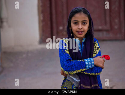 Portrait of a young Omani girl in the traditional Omani outfit. Nizwa ...