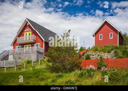 Fishing boats and stages in the harbor at Tilting, Fogo Island, Newfoundland and Labrador, Canada. Stock Photo