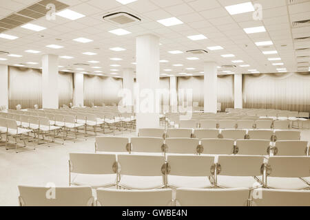large and modern white auditorium with curtains Stock Photo