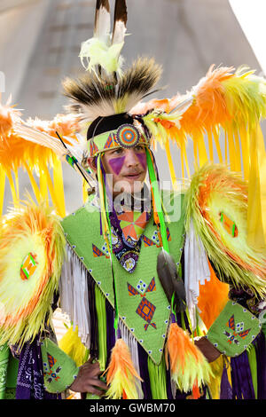 A Native American dancer from the Arapahoe people dressed in traditional costume at the Indian Village during Cheyenne Frontier Days July 25, 2015 in Cheyenne, Wyoming. Frontier Days celebrates the cowboy traditions of the west with a rodeo, parade and fair. Stock Photo