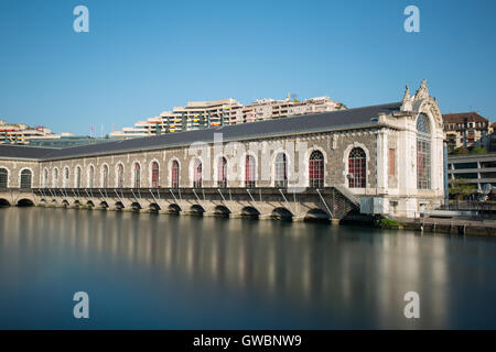 Long exposure view of the Batiment des Forces Motrices on the Rhone river, Geneva - Switzerland. Stock Photo