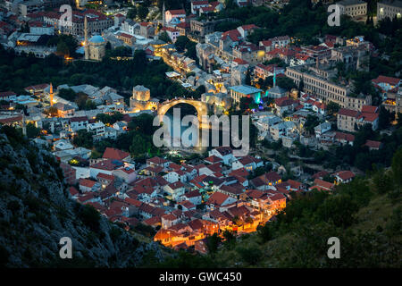 An aerial view of the Neretva river which runs across old Mostar and its Old Bridge (Stari Most). Bosnia Herzegovina From above. Stock Photo