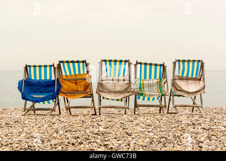 Empty deck chairs on Beer beach, Devon, south west England. Stock Photo