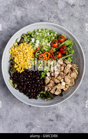 A large bowl of Southwestern Chicken Salad with Creamy Avocado Dressing is photographed from the top view. Stock Photo