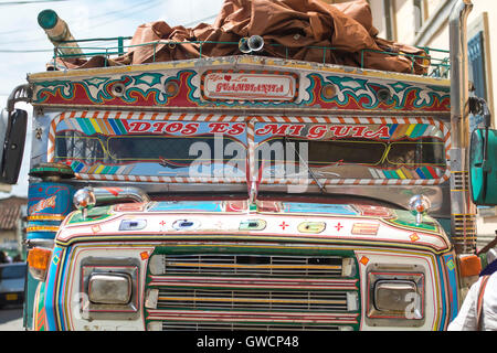 Chiva Buses, a decorated Colombian rural bus. Tuesday is the day on which the Misak, Guambianos, Indigenous people reach the mar Stock Photo