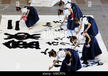 Japanese schoolgirls competes for the written technology in a Kagawa Calligraphy Festival Stock Photo