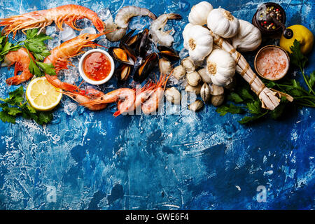 Seafood copy space Background with fresh raw Prawns, Clams, Mussels, Vongole, Shrimps and Ingredients Stock Photo