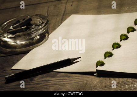 old notebook and pencil on table Stock Photo