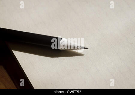 old notebook and pencil on table Stock Photo