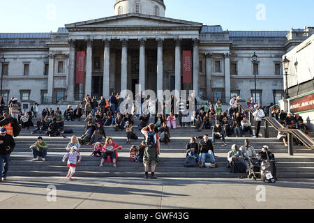 London.England, April 2011. National Gallery .People sitting on the steps in front of the main entrance to the National Gallery. Stock Photo