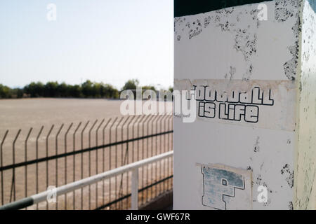 A sticker at a small football stadium says 'Football is Life' Stock Photo