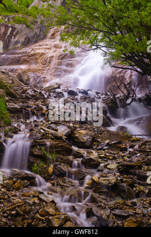 waterfall among the rocks in the forest Stock Photo - Alamy