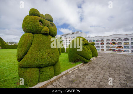 TULCAN, ECUADOR - JULY 3, 2016: animal sculptures located at the side of one path of the cemetery Stock Photo