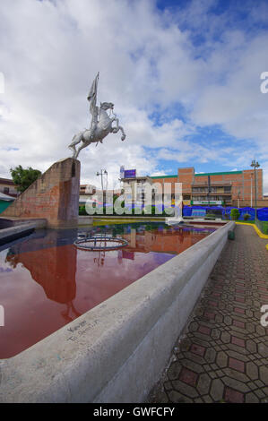 TULCAN, ECUADOR - JULY 3, 2016: the statue of simon bolivar riding a horse is located in an important park of the city Stock Photo