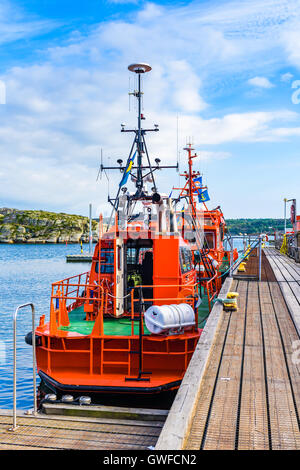 Marstrand, Sweden - September 8, 2016: Environmental documentary of red pilot boats moored in the harbor. Stock Photo