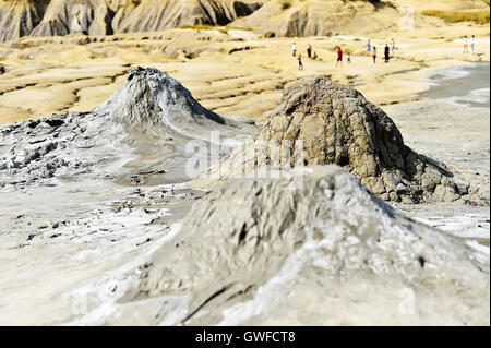 Landscape with mud volcanoes also known as mud domes erupting in summer Stock Photo