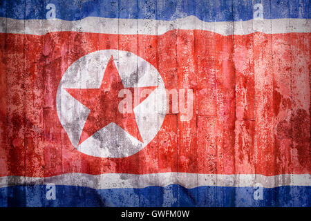 Grunge style of North Korea flag on a brick wall for background Stock Photo