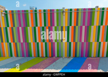 Multicolored painted sidewalk and walls in Brooklyn, New York. Stock Photo