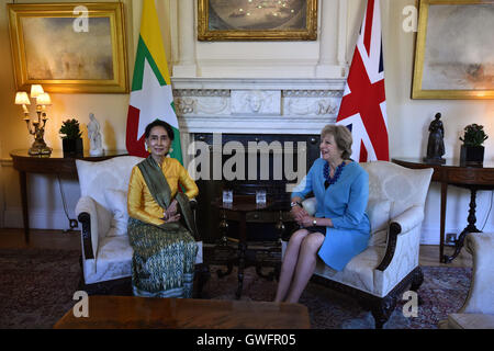 Prime Minister Theresa May speaks with Myanmar's State Counsellor Aung San Suu Kyi at the beginning of their meeting, inside 10 Downing Street in central London. Stock Photo