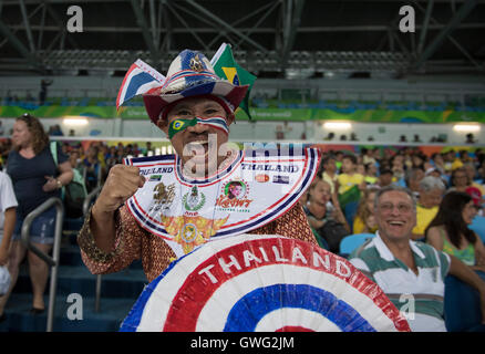 A fan from Thailand dressed in patriotic garb cheers at the fencing venue at the RIo 2016 Paralympic Games. Stock Photo