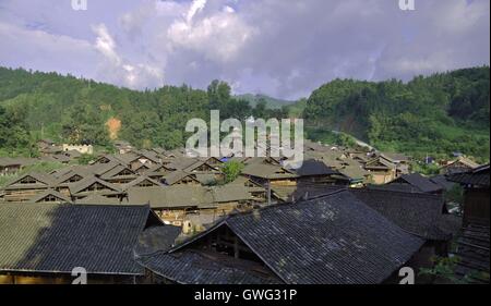 China. 14th Sep, 2016. Guizhou, CHINA-August 11 2016: (EDITORIAL USE ONLY. CHINA OUT) .Traditional village of Dong minority group in Congjiang County, southwest ChinaÂ¡Â¯s Guizhou Province. Dong ethnic minority people are traditionally live on rice with skilled cultivating on famous terraces. It is also an ethnic group skilled in wooden architectures with no nails. The unique wooden architectures of inhabited houses and drum towers are the main features of Dong Minority. A typical Dong house is a three-storey one built on wood pillars; people live in the second floor, and the third floo Stock Photo