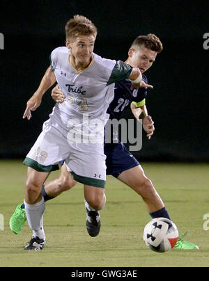 Williamsburg, VA, USA. 13th Sep, 2016. 20160913 - William and Mary midfielder RILEY SPAIN (23) tries to escape the grasp of Georgetown midfielder BAKIE GOODMAN (20) in the first half at Martin Family Stadium in Williamsburg, Va. © Chuck Myers/ZUMA Wire/Alamy Live News Stock Photo