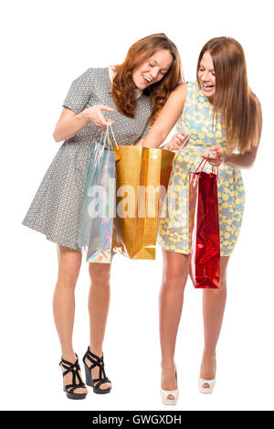 girl shows her friend purchase on the a white background Stock Photo