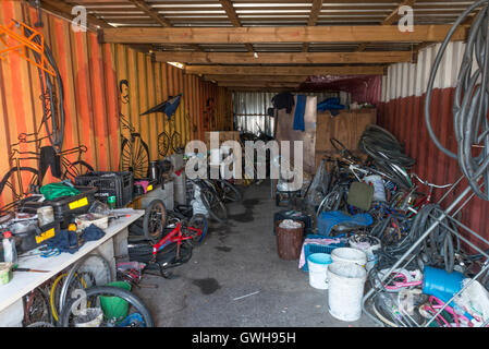 Spareparts and tools in a township bicycle workshop, Cape Town, South Africa Stock Photo