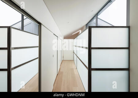 Interior of a modern house, long corridor with wall closets Stock Photo