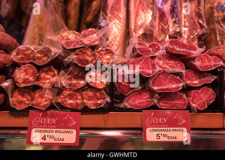 A walk around the market is a feast for all the senses. Fresh meat produce for sale at the Mercado de la Boqueria, Barcelona. Stock Photo