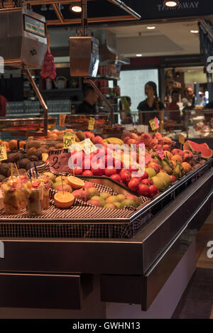 A walk around the market is a feast for all the senses. Fresh fruit produce for sale at the Mercado de la Boqueria, Barcelona. Stock Photo