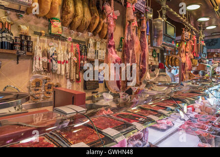 A walk around the market is a feast for all the senses. Fresh meat produce for sale at the Mercado de la Boqueria, Barcelona. Stock Photo
