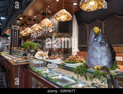 A walk around the market is a feast for all the senses. Fresh fish produce for sale at the Mercado de la Boqueria, Barcelona. Stock Photo