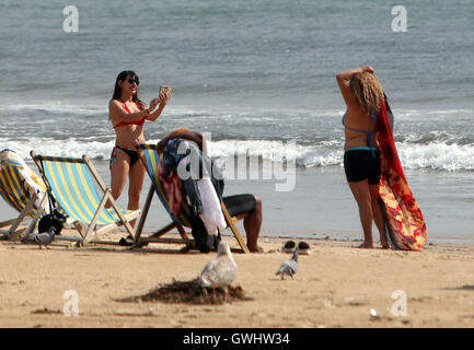 Sunbathers on the beach at Bournemouth in Dorset, as today could be the hottest September day in more than 50 years. Stock Photo